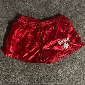 Shiny red stretchy lifeguard shorts, worn once, size medium